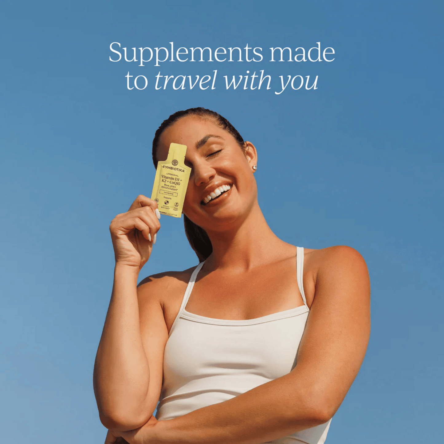 Alternate image of model holding Cymbiotika Vitamin D3 + K2 + CoQ10 Pack (28 count)