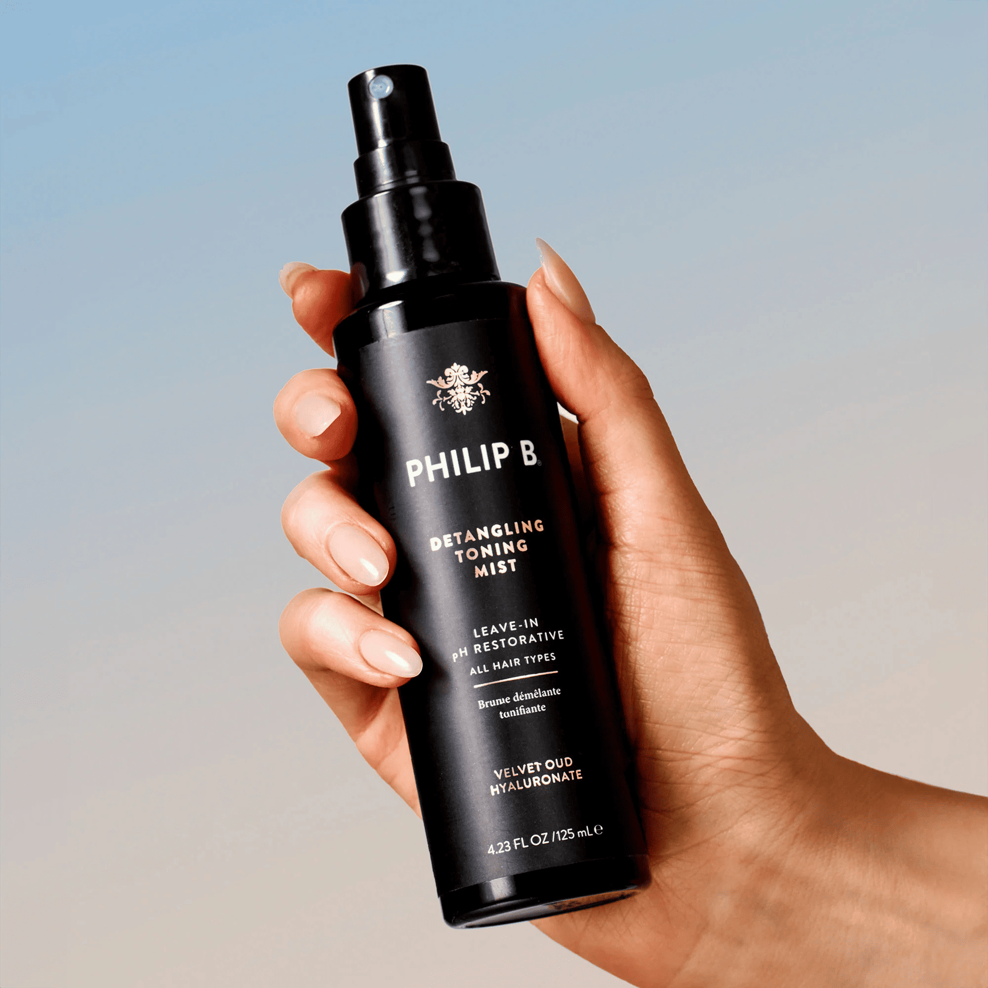 Hand image of Philip B. Detangling Toning Mist with Velvet Oud