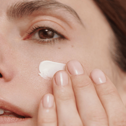 Alternate image of model applying cream