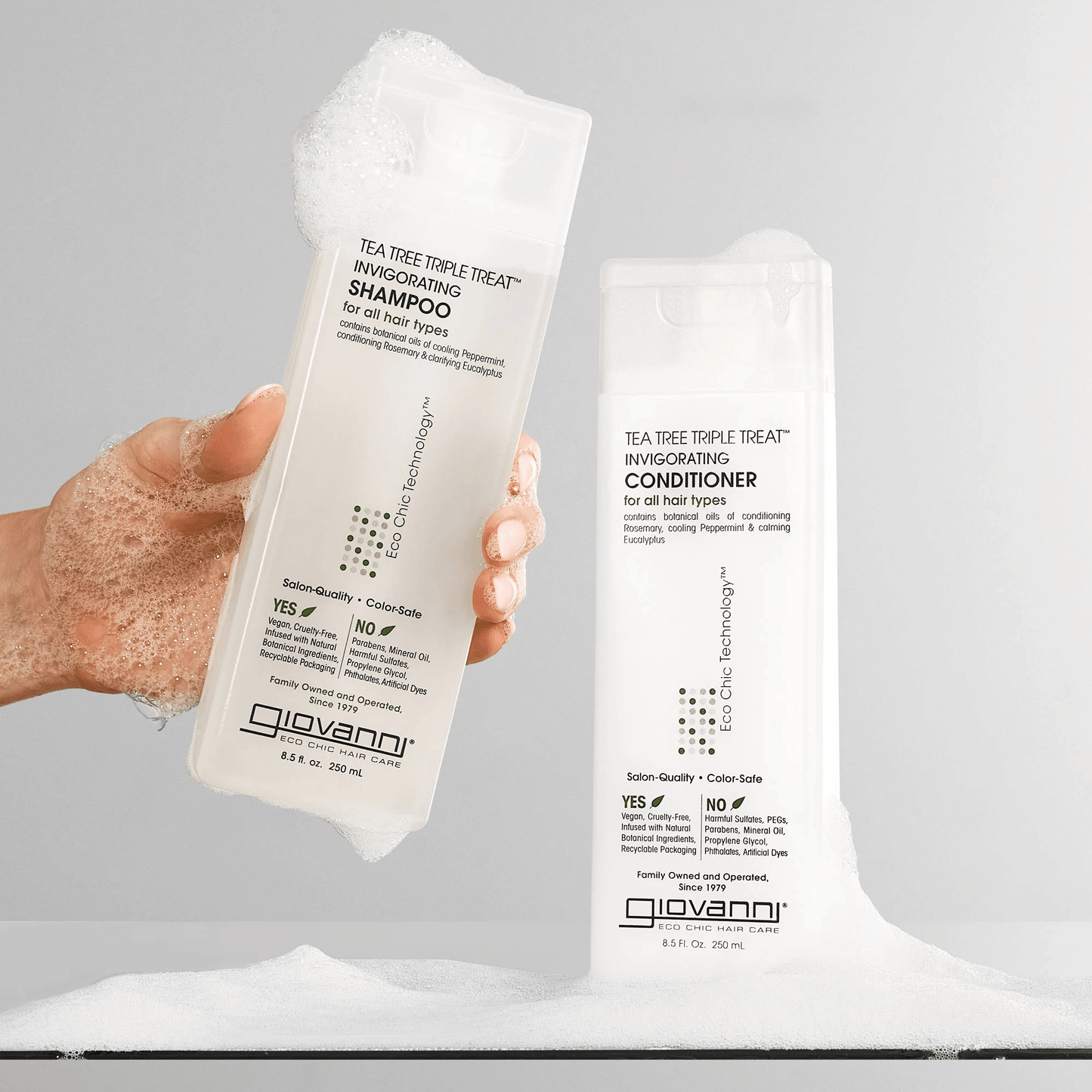 Alternate image of model holding shampoo bottle next to matching conditioner