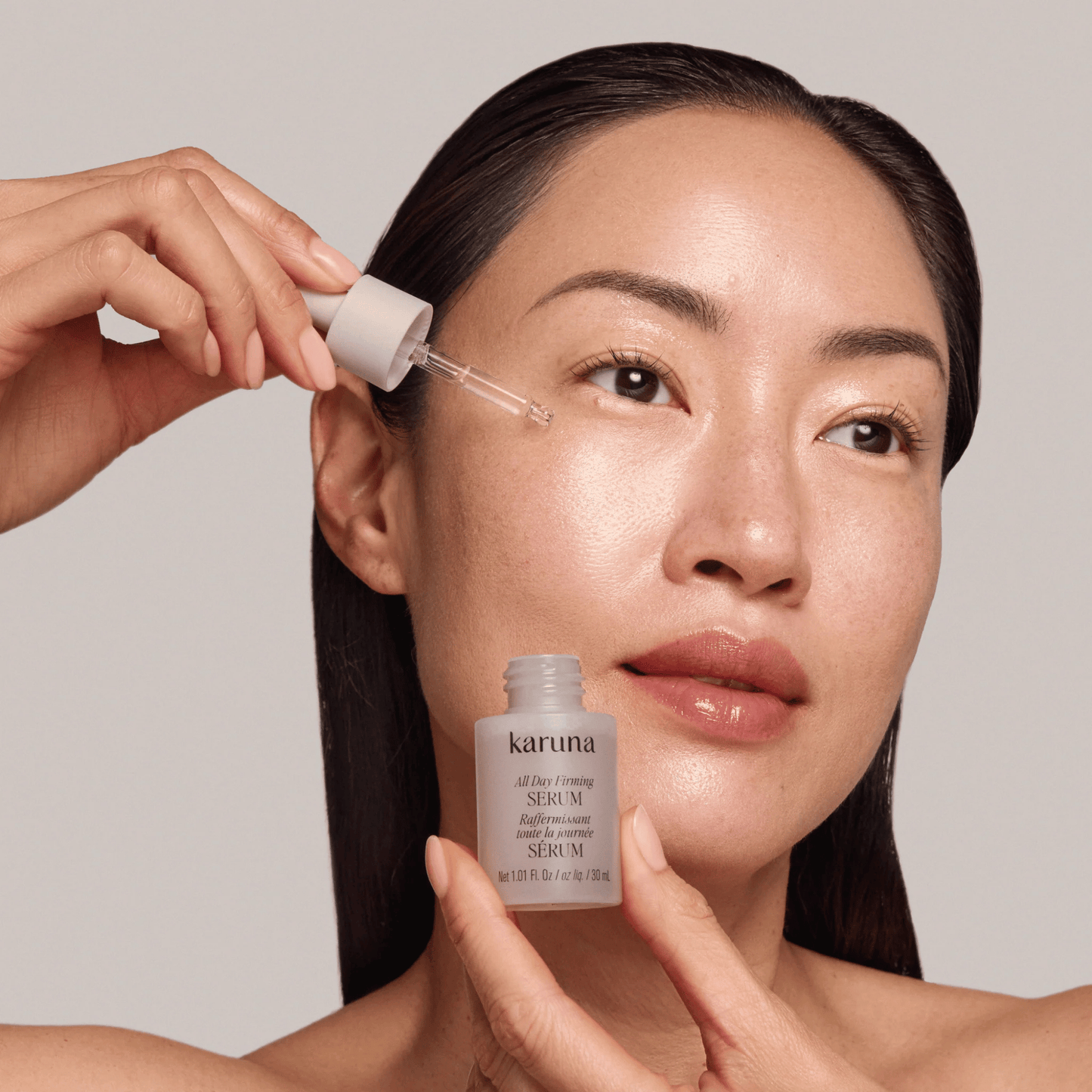 Alternate image, model applying serum to skin