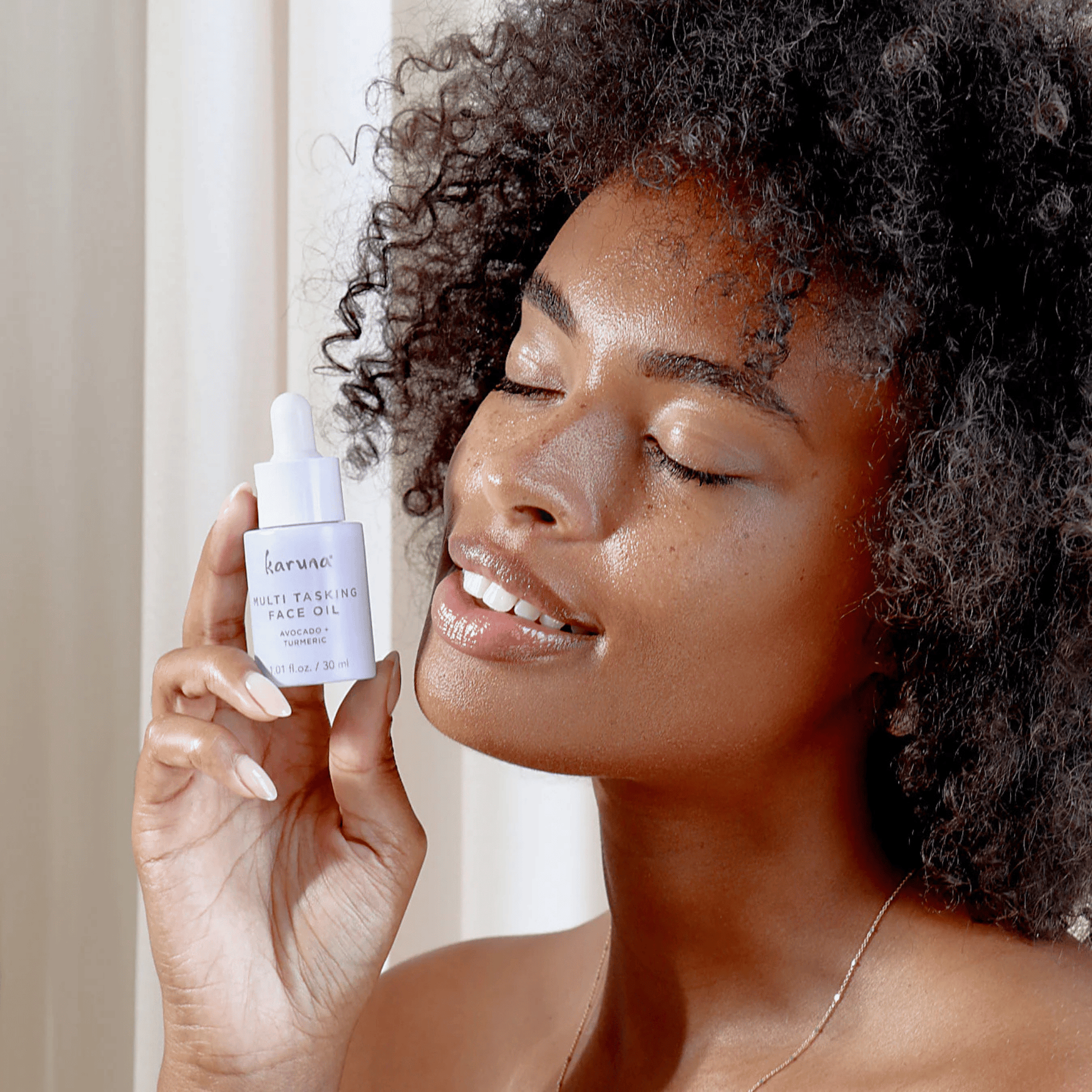Alternate image, Model holding purple dropper bottle