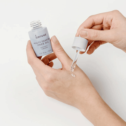 Alternate image, Model applying oil to skin