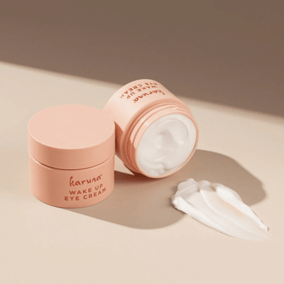 Alternate image, Opened Pink Wake Up Eye Cream jar with cream texture spread