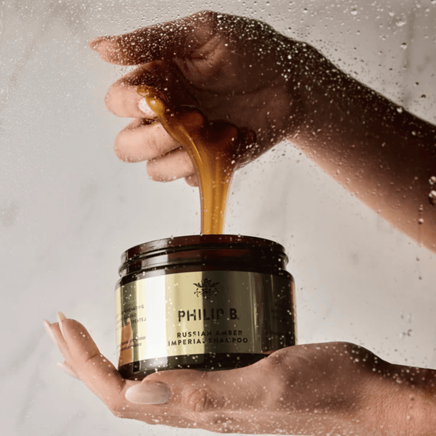 Hand image of Philip B. Russian Amber Imperial Shampoo 