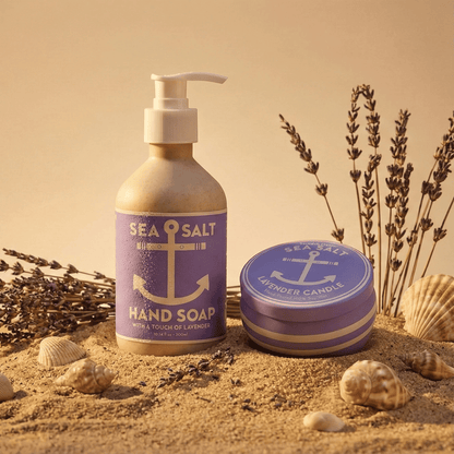 Alternate image of purple soap next to Lavender Sea Salt candle on beach