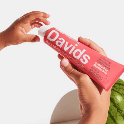 Atlernate Image of Natural Strawberry Watermelon Whitening + Anti-Plaque Toothpaste, red toothpaste tube