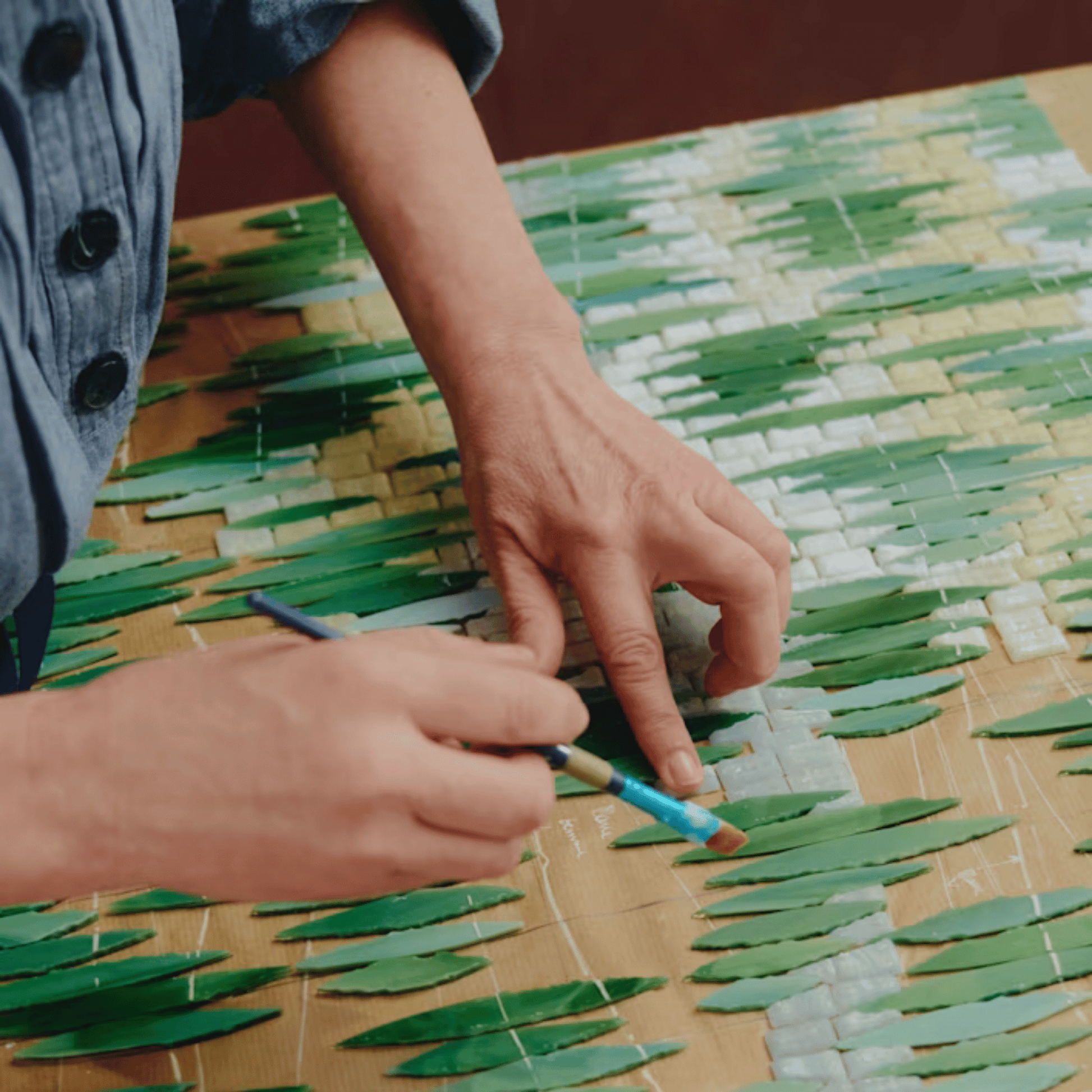 Alternate image of mosaic artist creating product art for Diptyque Limited Edition Pinede Candle