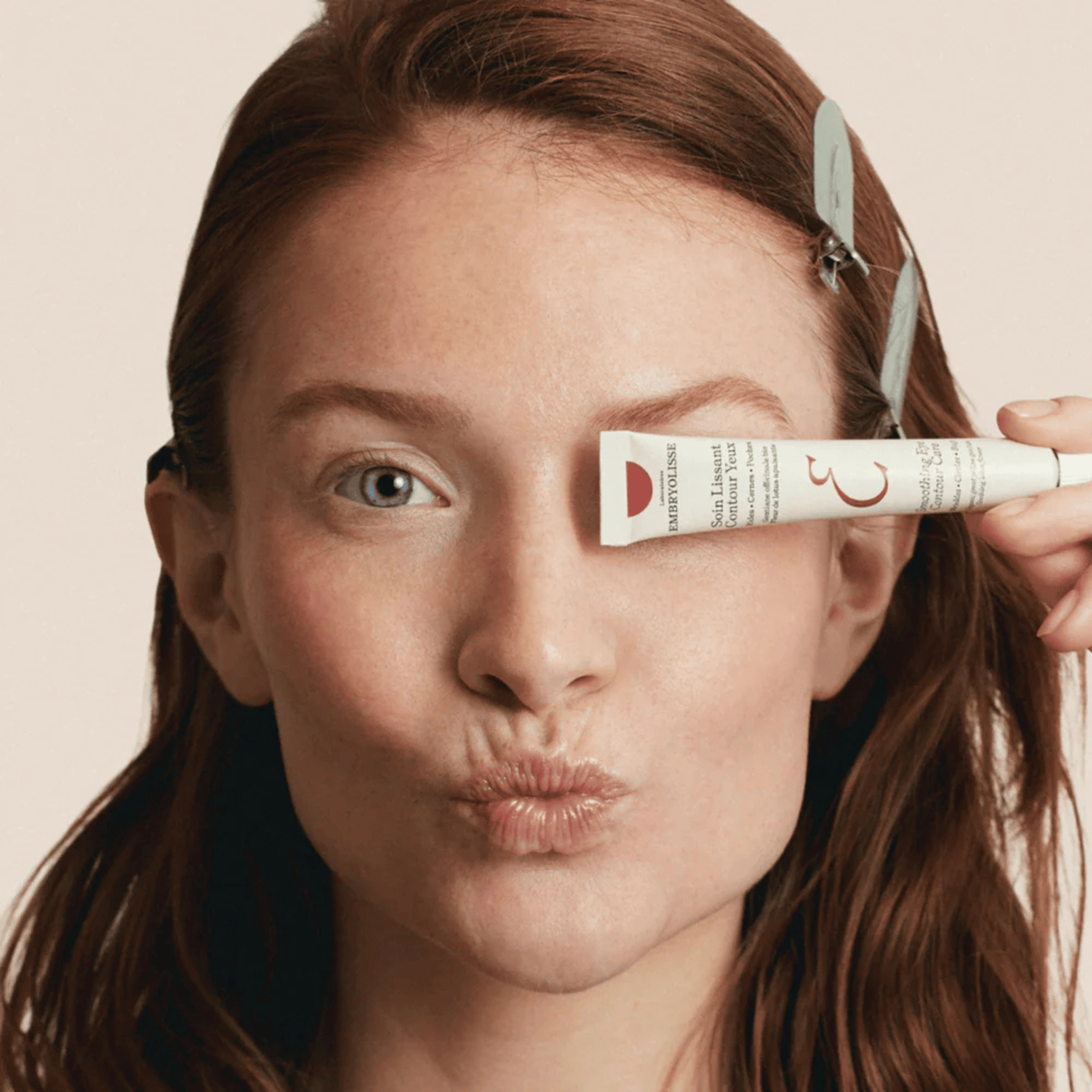 Alternate Image of Smoothing Eye Contour Care, off white tube with red writing with model