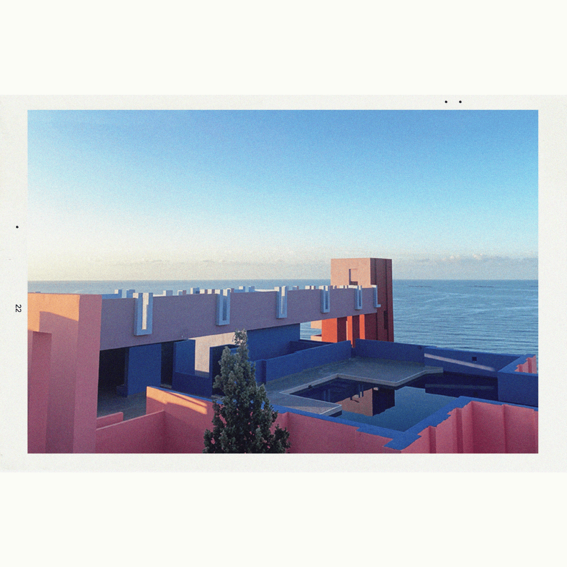 Primary Image of Syrus EDP, brightly colored building by the sea