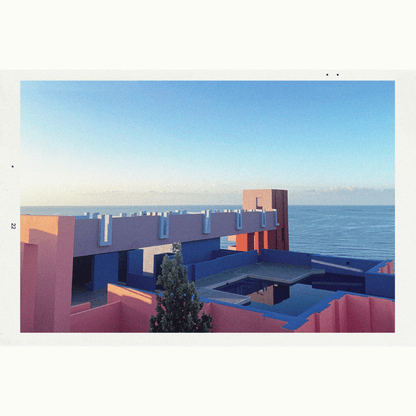 Primary Image of Syrus EDP, brightly colored building by the sea