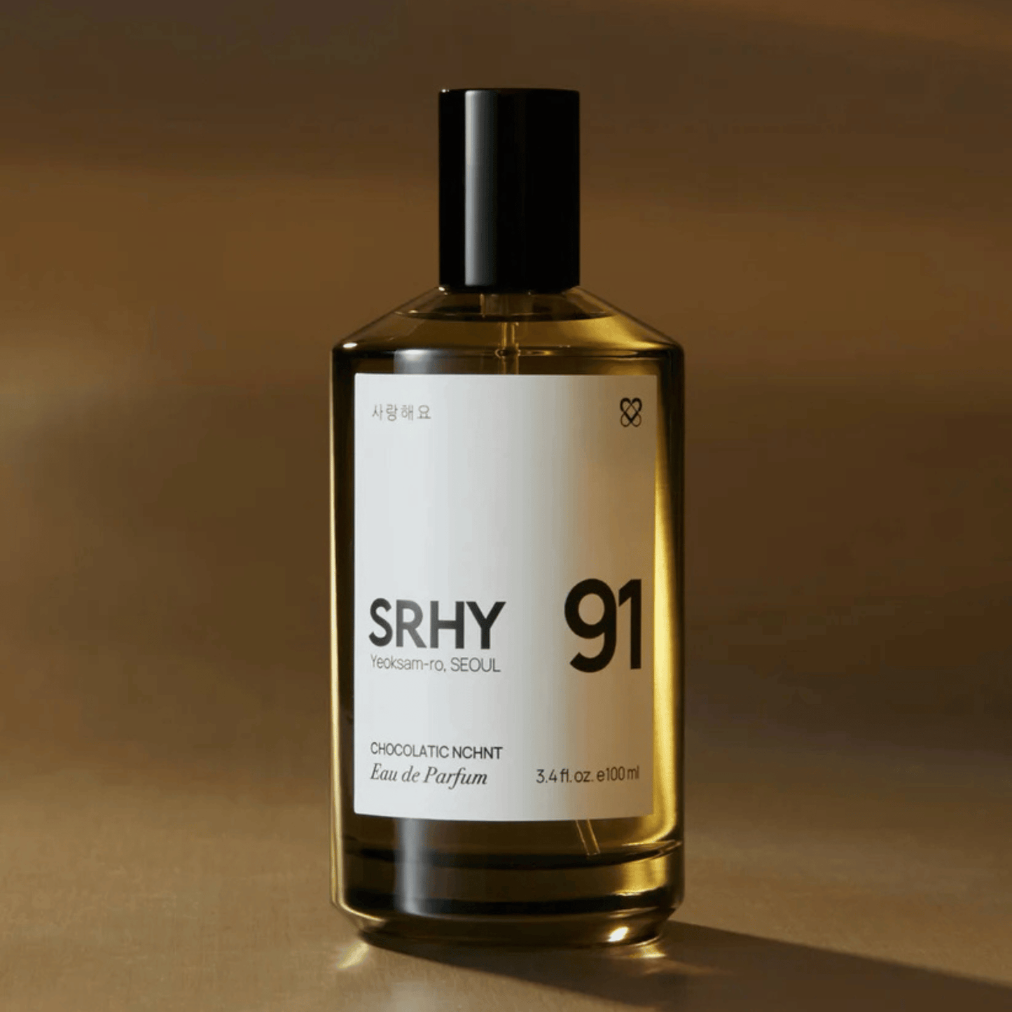 Alternate Image of 91. Chocolatic Nchnt EDP, dark round perfume bottle with white label